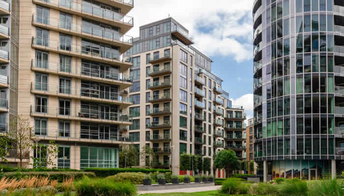 Locksmith customers modern apartment building Battersea green garden area SW11